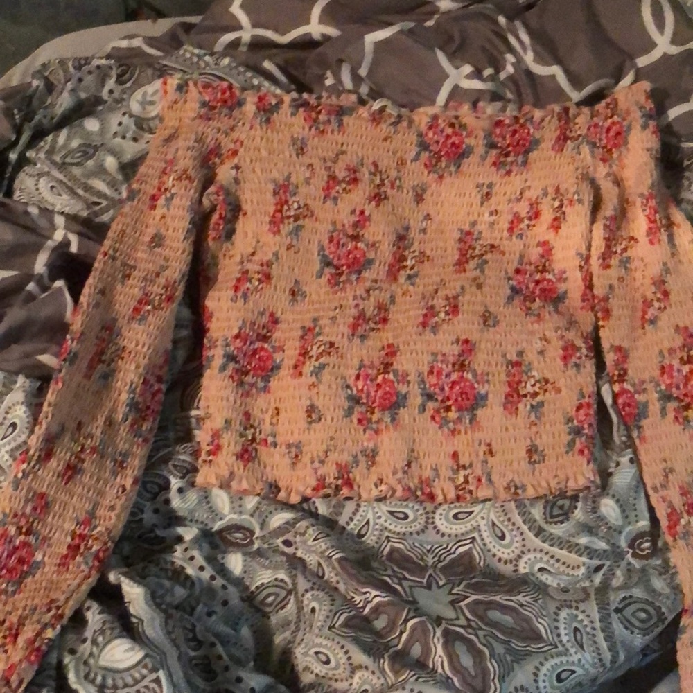 i’m selling a pink flower long sleeved shirt. It’s an xl but fits like a medium